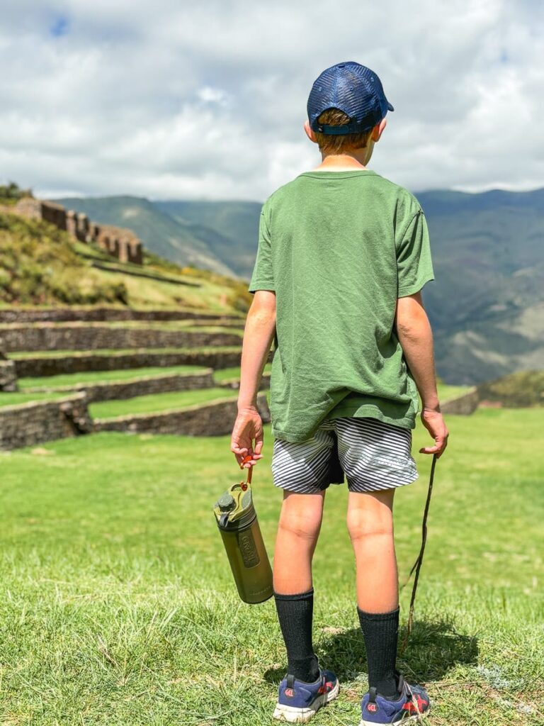 boy holding Grayl GeoPress at Tipon Peru