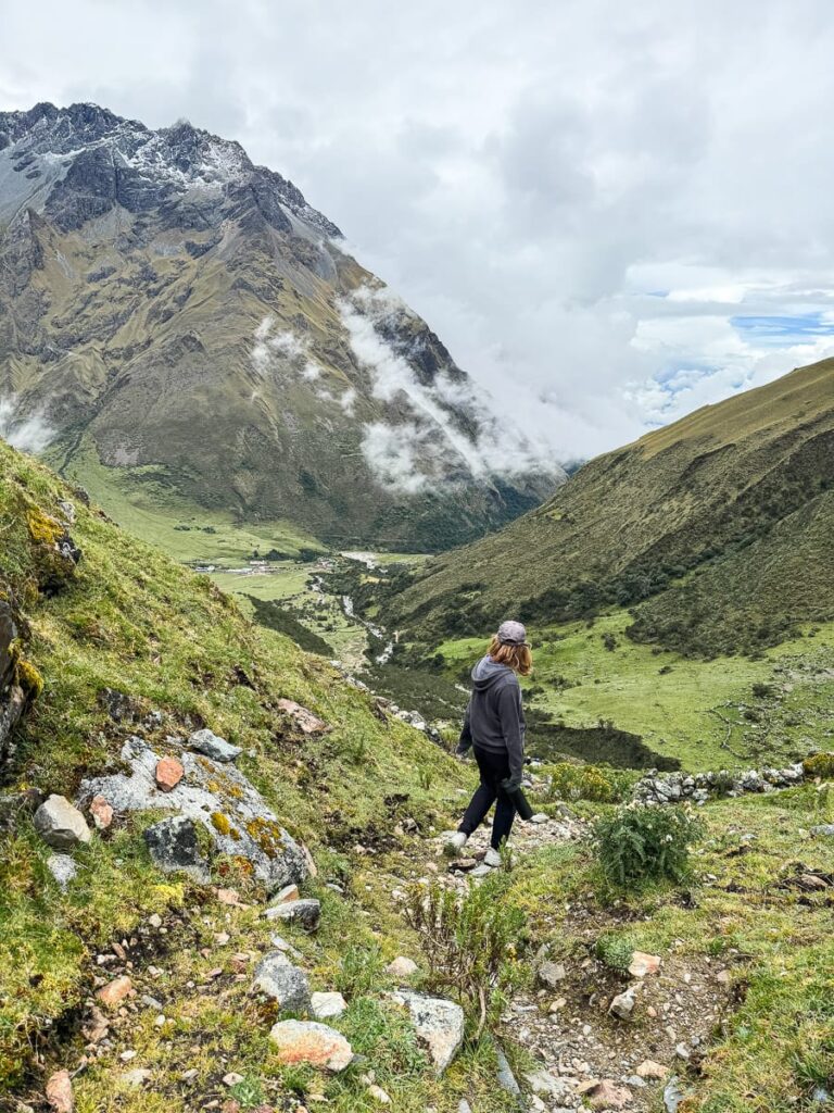 Girl walking in Peru mountain range