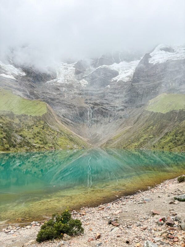 Humantay Lake with clouds over mountains