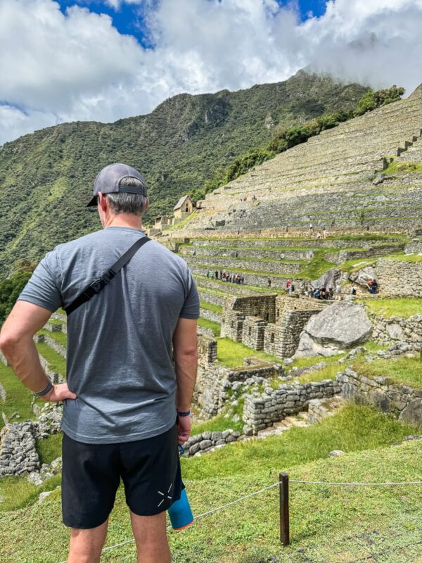 Machu Picchu with man standing