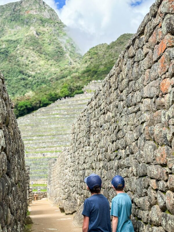 kids looking at Machu Picchu ruins