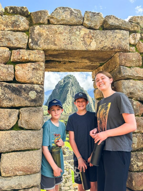 kids standing in doorway in Machu Picchu
