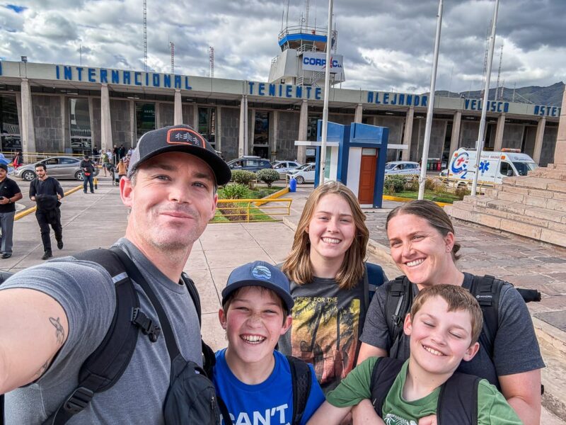 family in front of Cusco airport