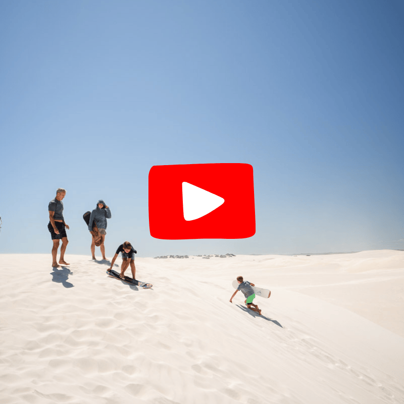 People sand surfing with YouTube play button overlay